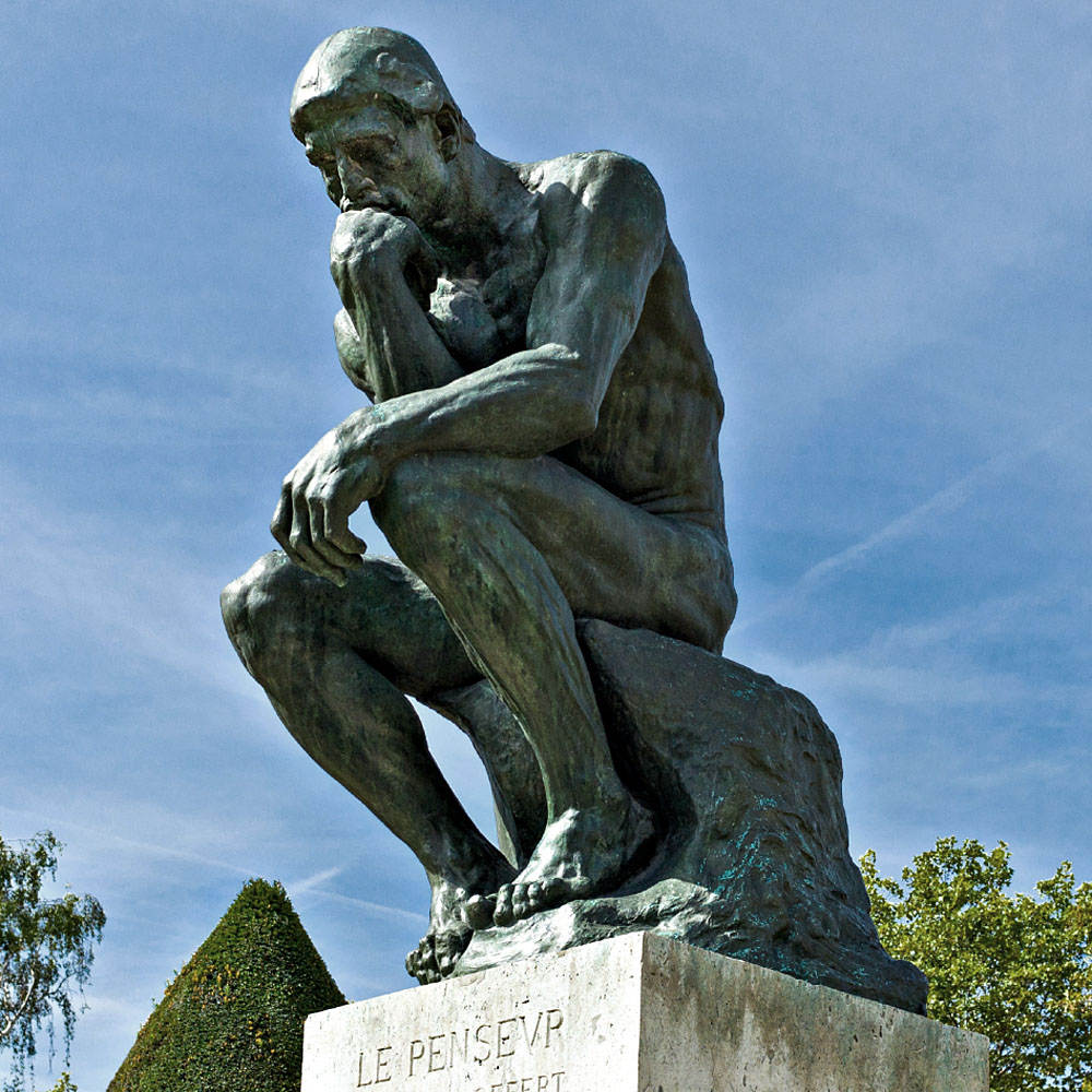 Paris,  France - August 31, 2011:  'Le Penseur' sculptures of August Rodi in the Rodin Museum garden.